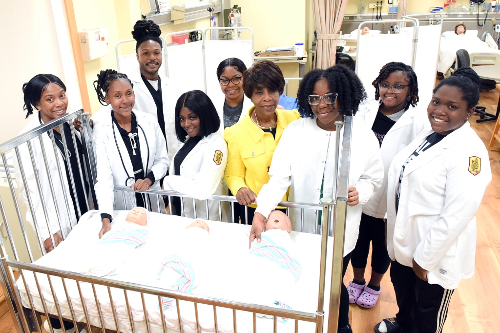 Nursing students in the simulation lab with Professor Williams and staff members. Pictured L to R:      Elyssa Kennedy, Taylor Qualls, LaMarques Woodard, Dakedra Holmes, Madison Powell, Diann Williams, Niveah Lowery, Shakirah Brown & Kylie Norman.